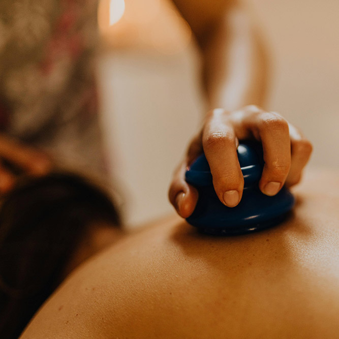 Hand performing cupping therapy