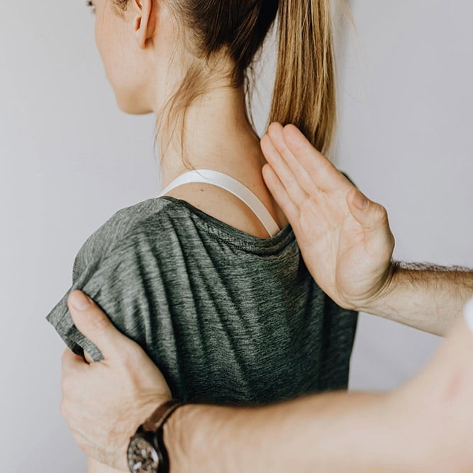 Hand performing spinal decompression therapy