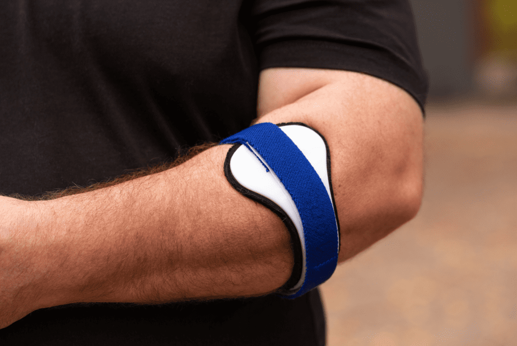 Counterforce elbow brace used for tennis elbow support while highlighting the limits of passive care compared to integrated movement rehabilitation.
