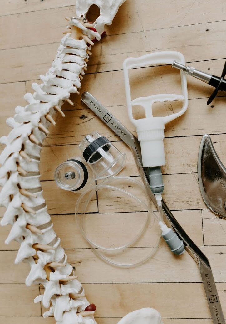 Chiropractic tools and spine model used as part of a modern chiropractic approach to treatment.